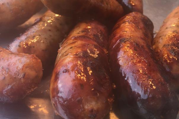 close-up picture of freshly made sausages on a tray