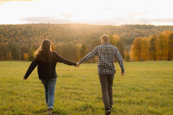 Couple running on grass