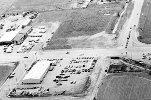 This is a black and white aerial photo showing the intersection of south Main Street and Florida Avenue (now Ken Pratt Blvd. in 2003).