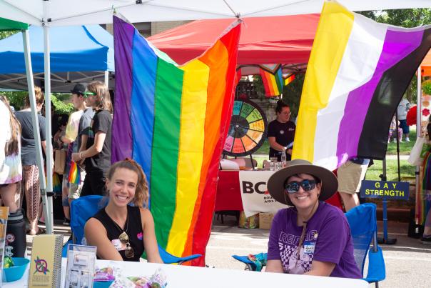 Pride festival, peope at a booth