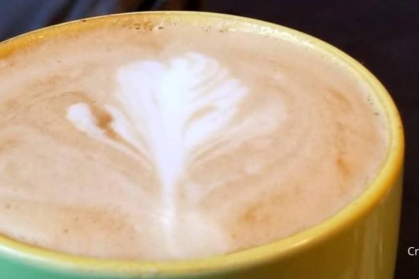 Beautiful design on top of a cafe latte at Javastop