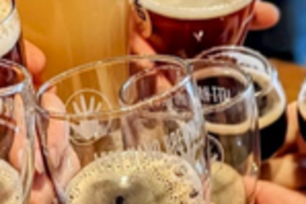 People celebrating with Left Hand Brews