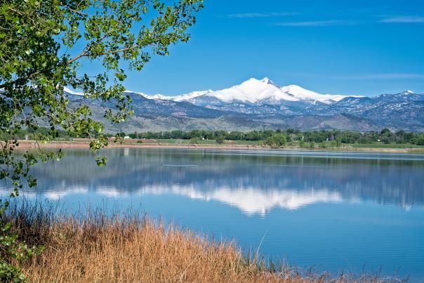 A lake with mountains in the distance