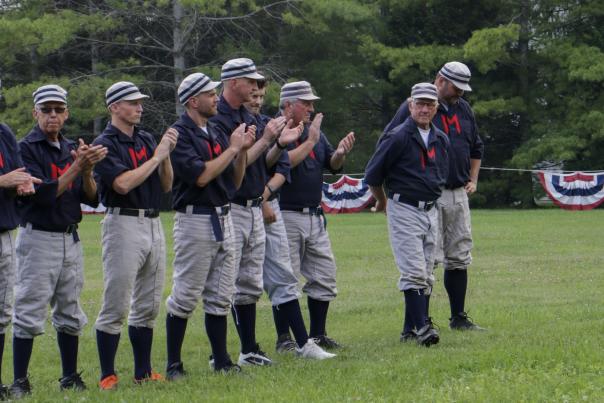 Players for the Fort Mackinac Never Sweats are introduced before a vintage base ball game on Mackinac Island