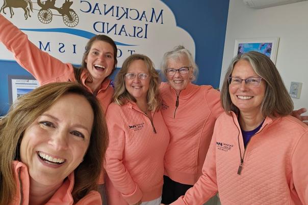 Group selfie of information specialists at the Mackinac Island Tourism Bureau