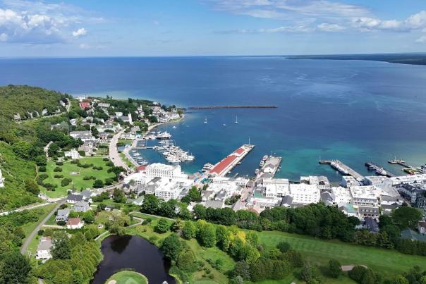 A view of the Mackinac Island marina from above with Fort Mackinac and Marquette Park center left