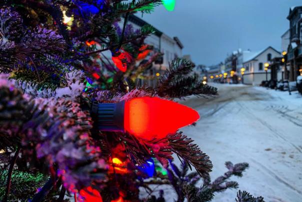 A red bulb on the Christmas tree in the middle of Mackinac Island’s Main Street