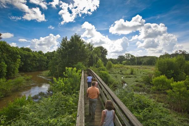 Crossing a footbridge in the Ocmulgee Wetlands near Macon, GA