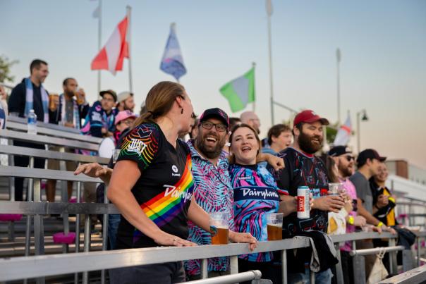 A group of fans celebrate in the stands at a Forward Madison soccer game