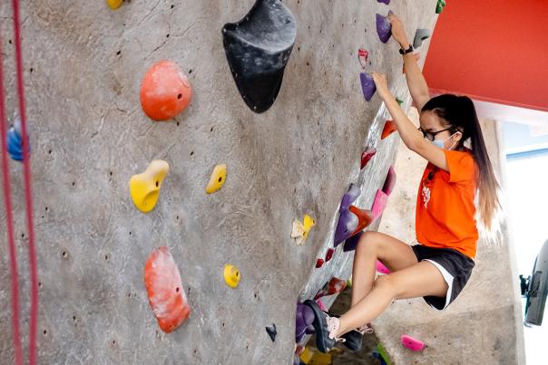 A child on the climbing wall at Boulders Climbing Gym