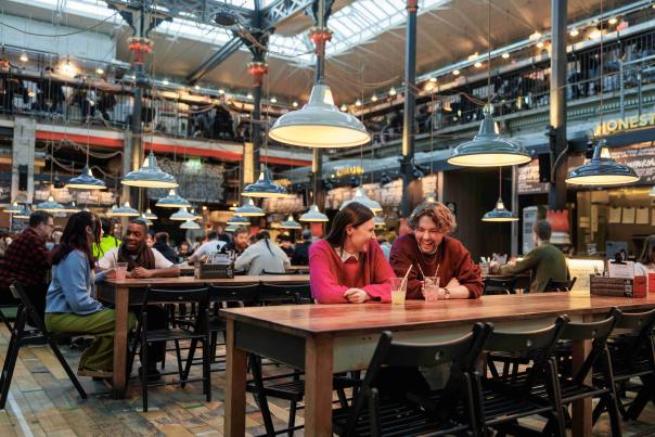 A couple enjoying drinks in Mackie Mayor