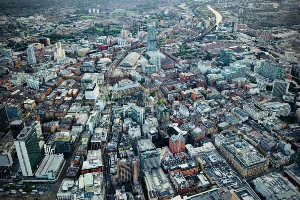 A detailed birds eye view shot of Manchester City Centre. Highlighting key buildings like City Towers, Manchester Central, Manchester Central Library, St Peter's Square, the Town Hall and more.
