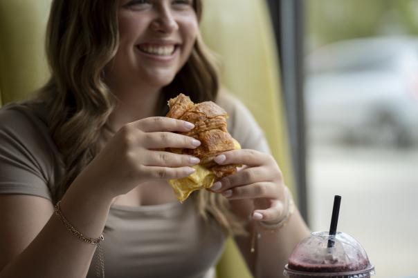 Wrap It Up woman holding sandwich