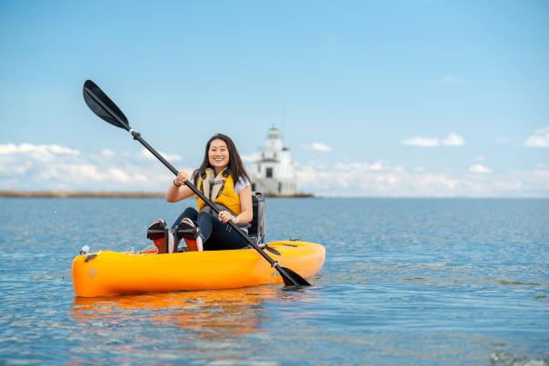 young woman kayaking in the Manitowoc harbor