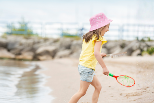 Girl Playing at Lighthouse Park Beach in Manitowoc