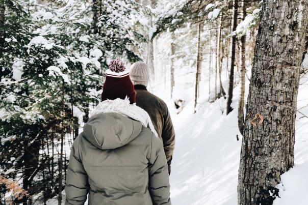 Couple hiking on trail in winter