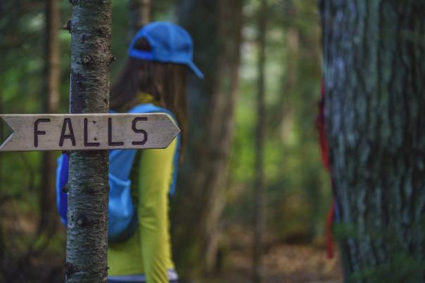 Signage pointing towards the falls at Yellow Dog Falls in Big Bay, MI