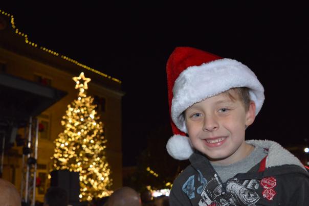 Boy in a Santa Hat at tree lighting ceremony