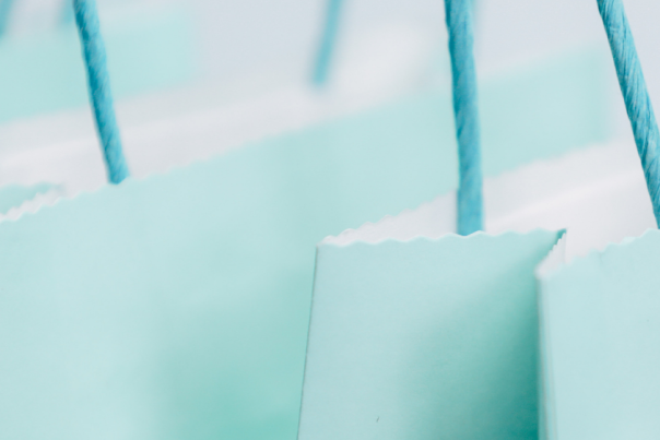 3 teal coloured paper bags with string handles