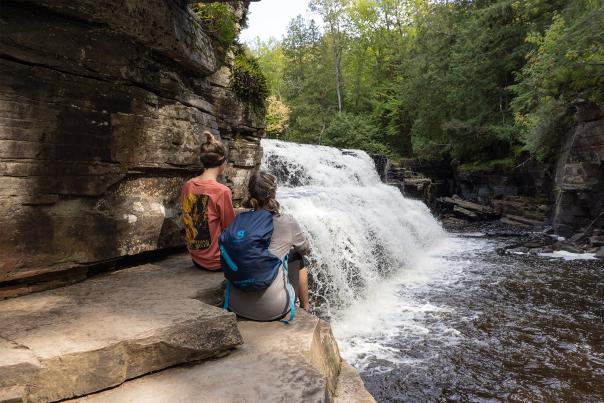 Two women overlooking Canyon Falls, located in the Upper Peninsula of Michigan