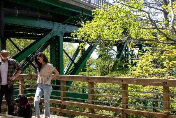 A couple and their dog at the Cut River Bridge in the Upper Peninsula of Michigan