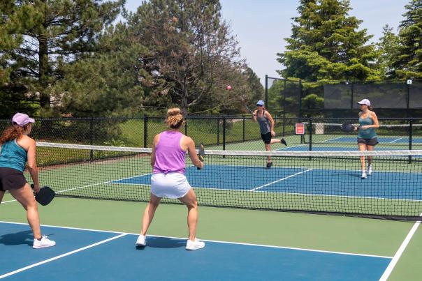 A group of ladies playing pickleball