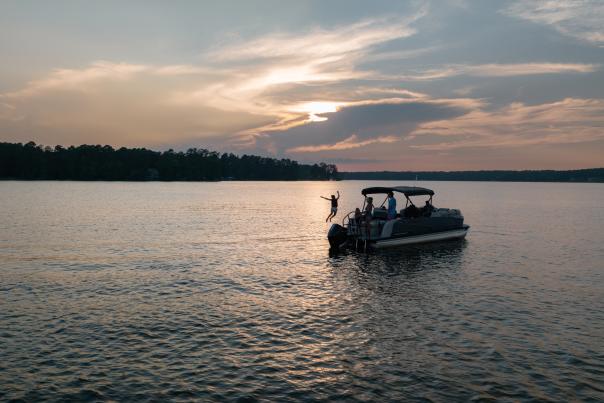 Lake Sinclair family on a boat at sunset