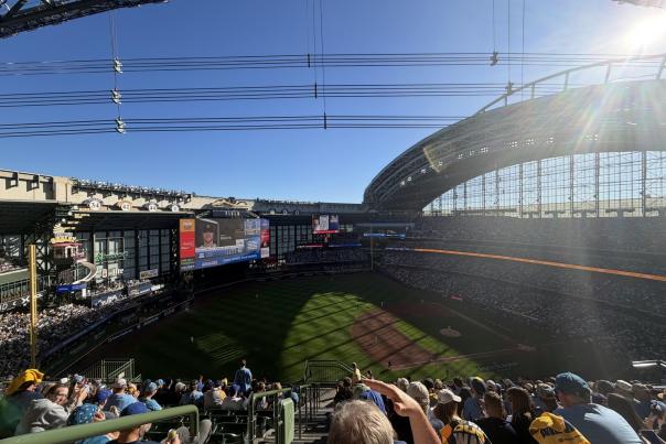 Wide-angle view of a packed American Family Field during the 2026 NLDS, with the baseball diamond, outfield and stadium roof visible as fans fill the stands.