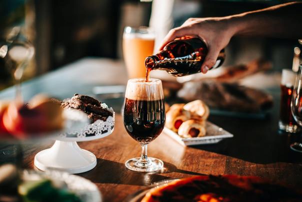 person-pouring-drink-on-wine-glass-1796698