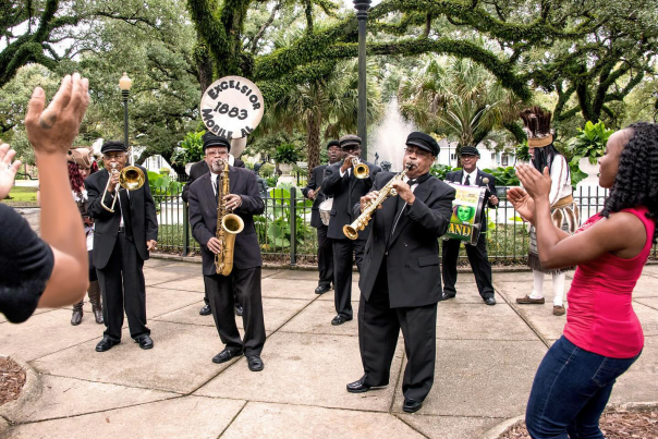Band playing in the park with people dancing