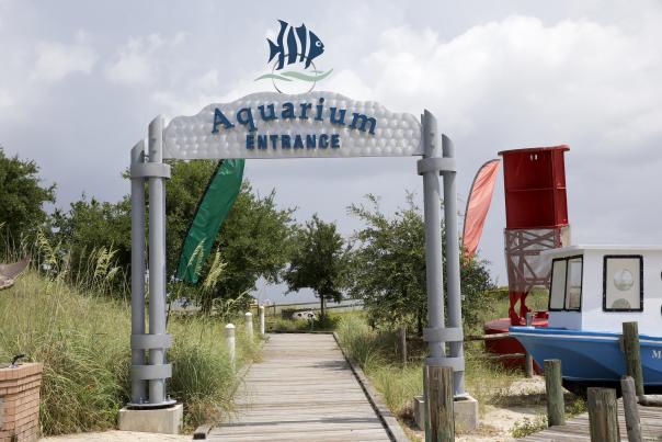 entrance arch with a boat docked to the right
