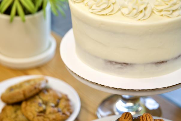cake, three cookies on a plate, chocolate bundt cake with pecans on top