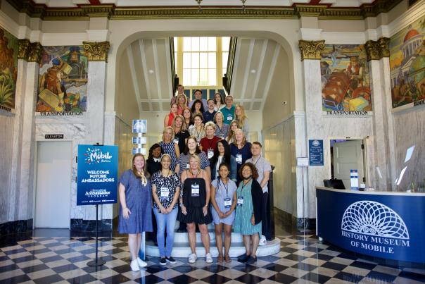 Group photo of Tourism Ambassador class on staircase