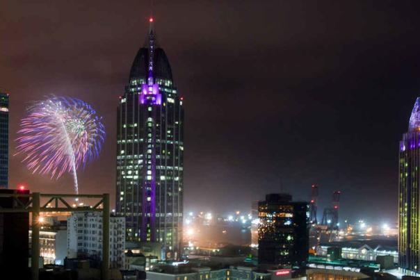 fire works exploding in the sky in downtown mobile alabama
