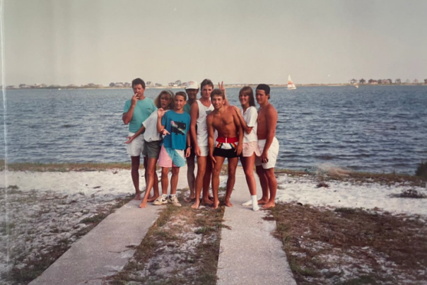 A group of teenage boys and girls are pictured on the beach in 1985