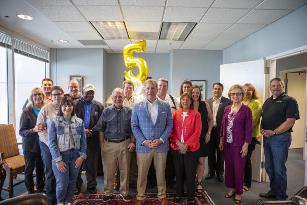 Group of people celebrating a work anniversary