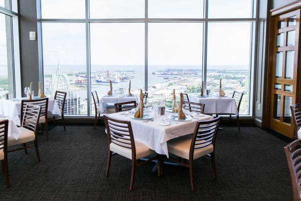 restaurant table and chairs overlooking the city