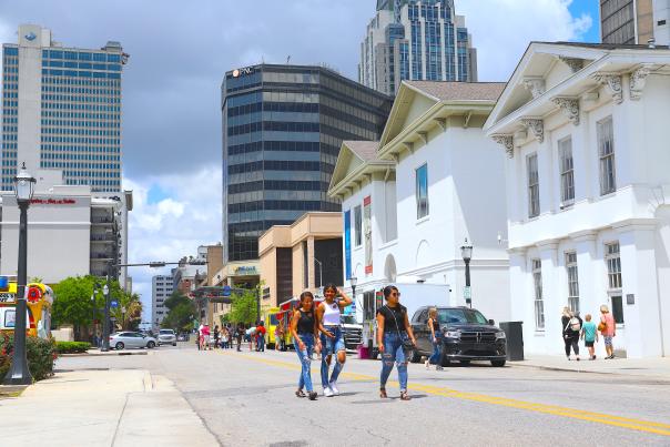 People walking in the street downtown Mobile