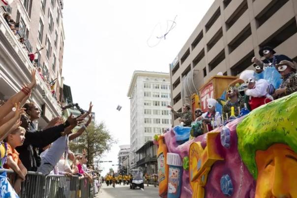 street view of Mardi Gras float and crowd