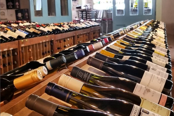 three rows of bottles of wine