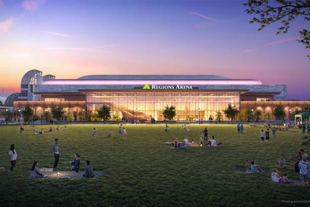 A rendering of Regions Arena, a large building at dusk with people picnicing on the lawn