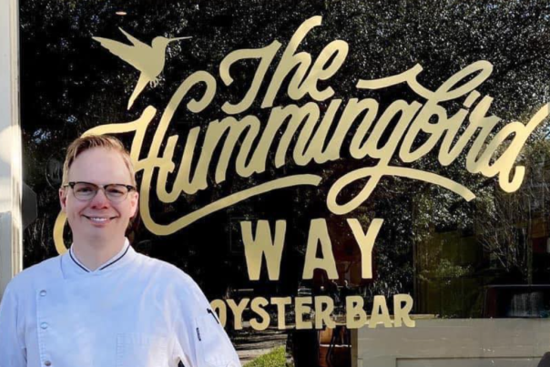 Chef Jim Smith stands in front of the Hummingbird Way Oyster Bar in Mobile, AL