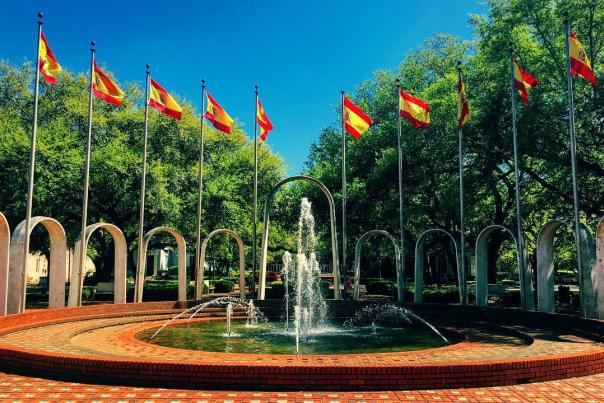 Fountain set in brick with ten flags surrounding it