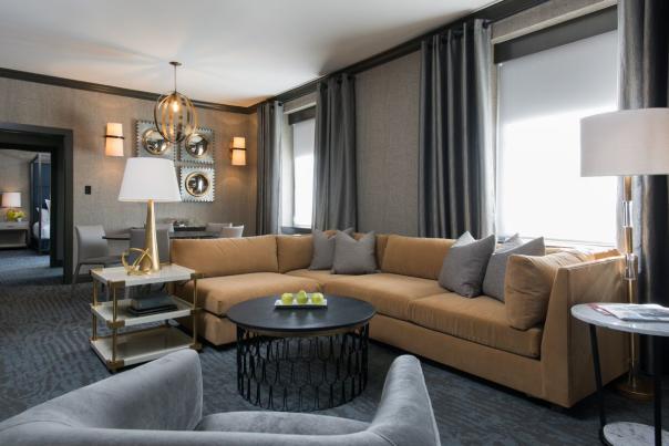 hotel suite with sectional sofa and coffee table