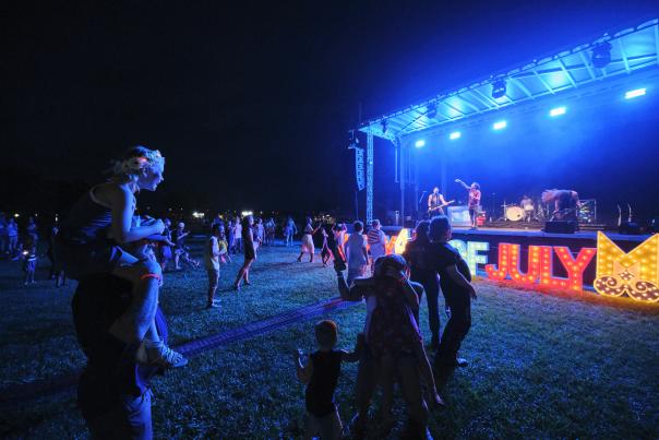 Crowd standing in front of the stage 4th of July festivities at USS ALABAMA Battleship Memorial Park