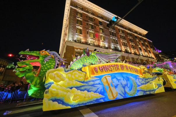 Mardi Gras float in front of high-rise building