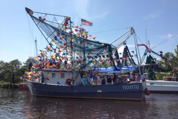 fishing boat decorated with colorful flags