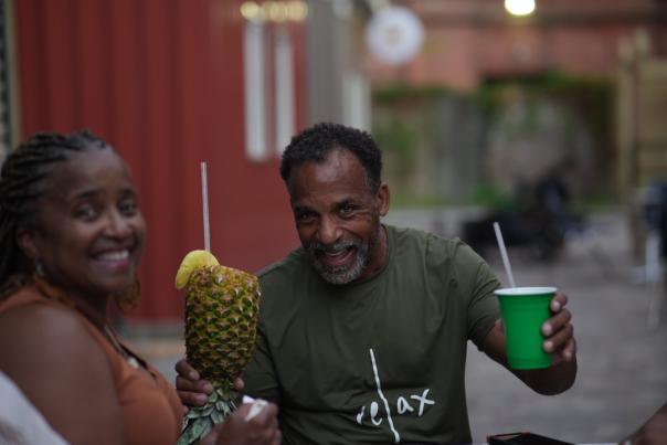 African American man and woman holding beverages
