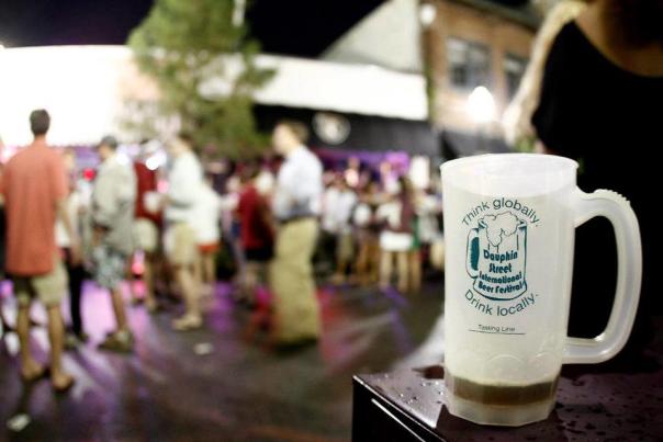 beer mug with a crowd in the background