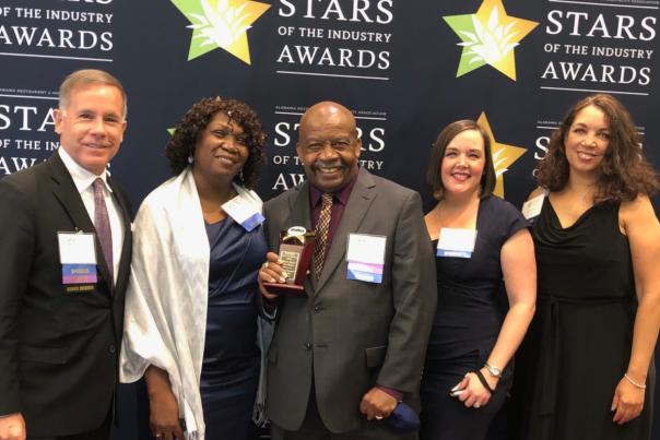 Group of 5 people posing for Star Awards